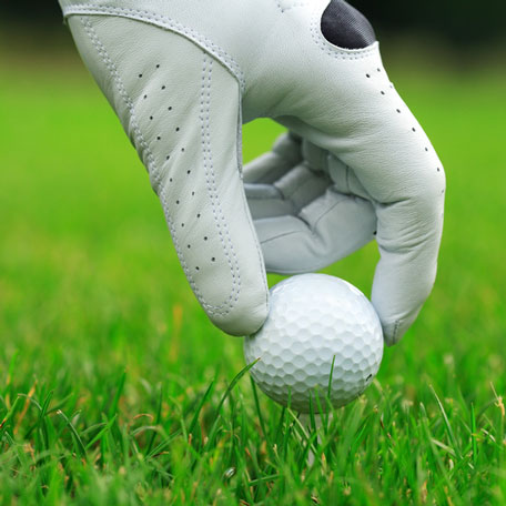 white golf glove and golf ball